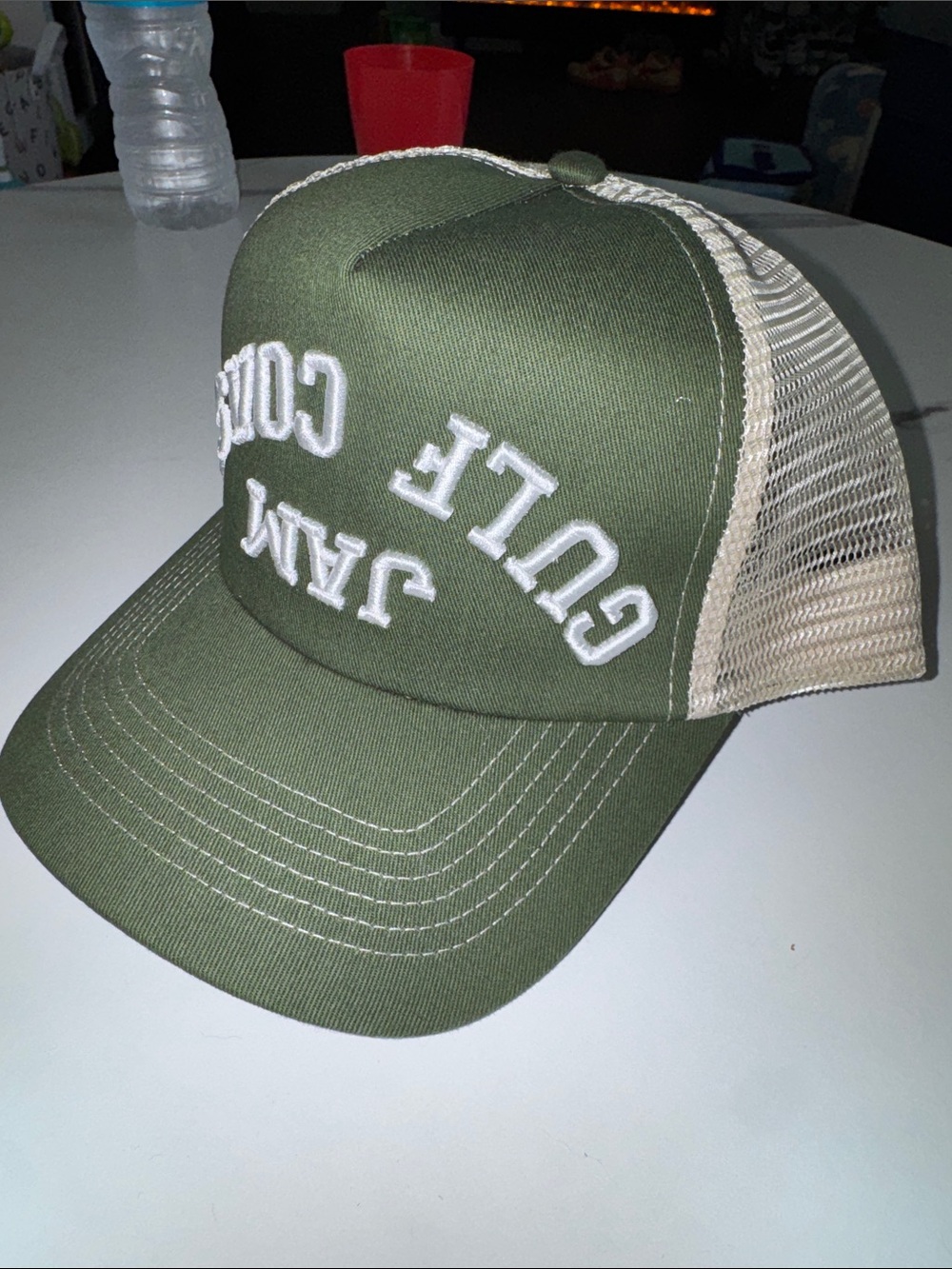 Olive Green Trucker Hat with White Embroidered Text “Gulf Coast Jam”